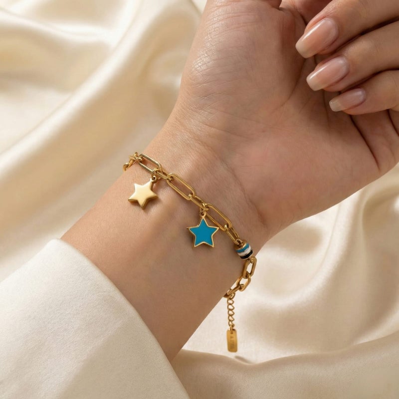 A stylish gold bracelet, crafted from rust-resistant stainless steel, featuring a modern chain design and star-shaped charms (gold and blue). A touch of elegance for your wrist with an adjustable clasp for a perfect fit. - Image 2